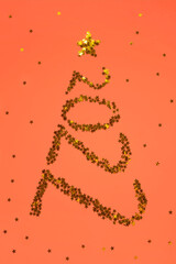Christmas tree in shape 2022 made of gold stars glitter on red background. Creative Christmas and New Year holiday concept