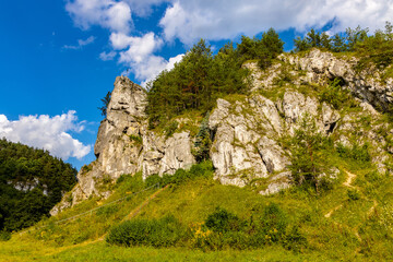 Fototapeta na wymiar Grupa Zabiego Konia limestone rock massif with Zabi Kon rock in Kobylanska Valley within Jura Krakowsko-Czestochowska upland near Cracow in Lesser Poland