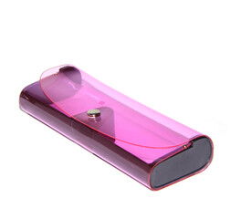 The new eyeglass case is made of transparent pink silicone. on an isolated white background.
