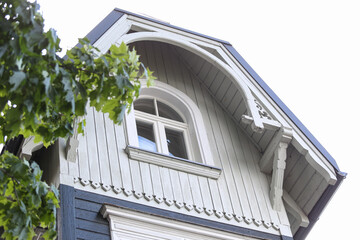 Close up details of old blue wood architecture house with small nique accents and details.