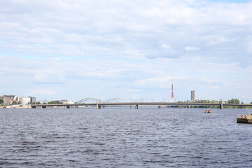 Cirtyscape view of river Daugava and transportation bridges in background.