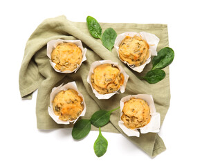 Tasty spinach muffins on white background