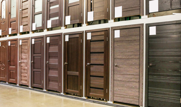 wall of doors in the store. interior doors installed in a row. different doors in the hardware store