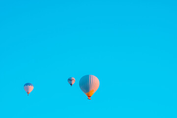 Hot air balloons on the sky in the morning. Magical view with hot air balloons.