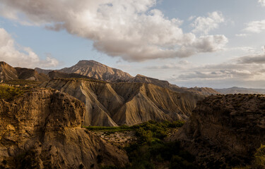 Landscape of Tabernas desert in Almeria, Spain, against cloudy sky