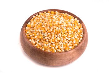 bowl with raw corn kernels on white background