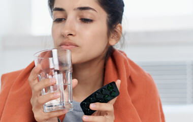 sick woman glass of water pills treatment feeling unwell