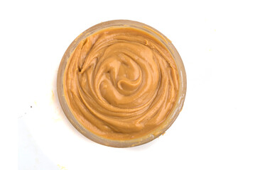 bowl of peanut butter on white background