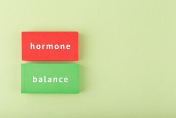 Medical hormone balance concept in bright green and red colors with copy space