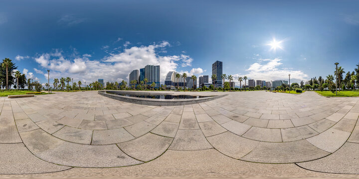 360 seamless hdri panorama view on square near seashore or ocean with skyscrapers with blue sky and good weather in equirectangular spherical projection, ready AR VR virtual reality content