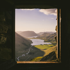 Warnscale Bothy Window View at sunset looking over Buttermere water in the Lake district National Park, England