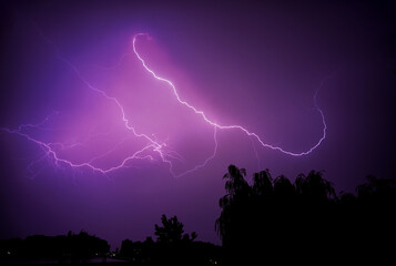 Naklejka na ściany i meble Lightning strike, thunderstorm, evening sky