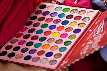 Close up of multi colored eyeshadow palette