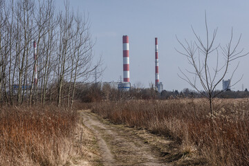 Fototapeta na wymiar Siekierki Power Station, view from Czerniakowskie Lake reserve in Mokotow district of Warsaw, capital of Poland