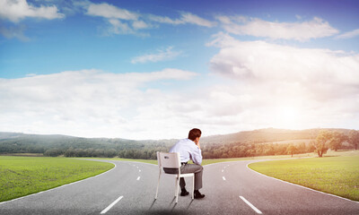 Young businessman sitting on an office chair