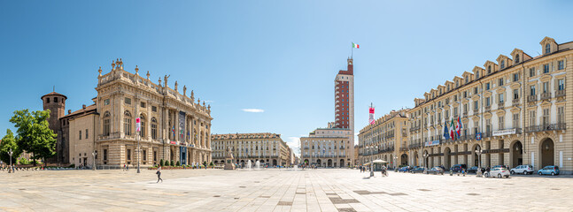 Fototapeta na wymiar Turin, Italy. May 12, 2021. Panoramic view of Piazza Castello with Palazzo Madama on the left, Littoria Tower far in the middle, and the building seat of the Regional Government on the right.
