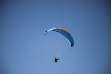 glider paragliding g against blue sky flying  adrenaline and freedom concept