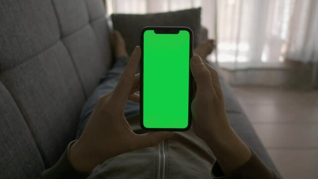 Single Tapping And Holding A Green Screen IPhone