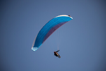 glider paragliding g against blue sky flying  adrenaline and freedom concept