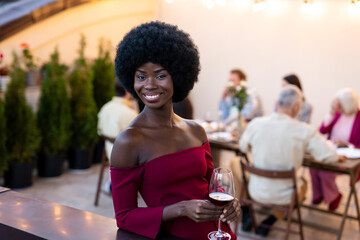 Family and friends celebrating at dinner on a rooftop terrace