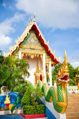 Naklejka premium Beautiful Wat Karon Buddhist temple travel summer trip famous landmark in Thailand.