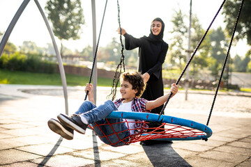 Woman with her children at the playground