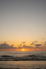 Obraz premium sunset on the beach.sunsets over sea and Burning sky and shining golden waves.