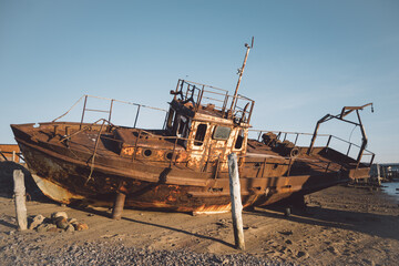 Abandoned old ship on the shore of barents sea in Teriberka, travel to north of Russia