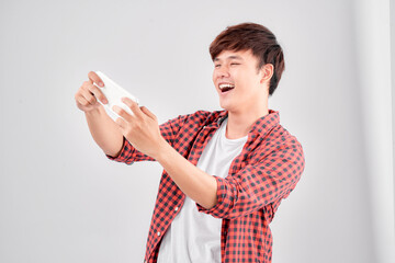 A portrait of surprised young man with mobile phone
