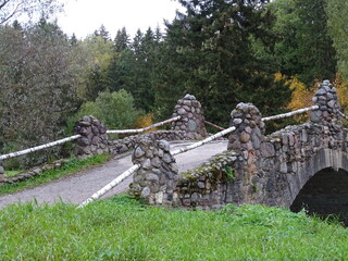 Fragment of an old stone bridge in a beautiful landscape 