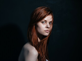Fototapeta premium woman with bare shoulders red hair posing isolated background