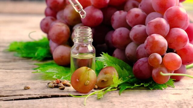 Bottle of grape seed oil. Selective focus.