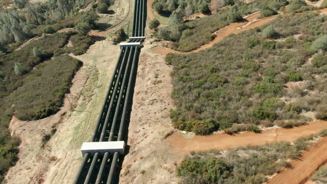 Aerial: Water pipes in the Hetch Hetchy water system at the base of the Sierra Nevada. California, USA