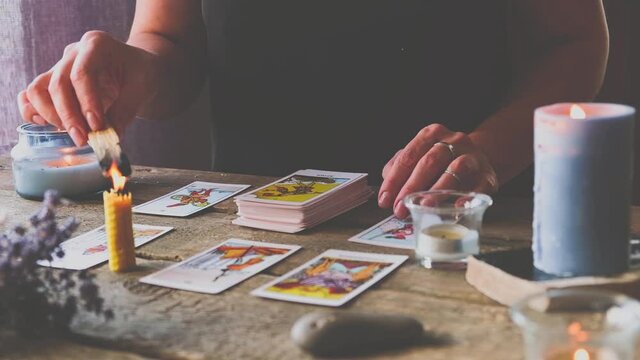 Tarot cards, Fortune telling on tarot cards at night by candlelight, magic crystal, occultism, Esoteric background. Fortune telling, tarot predictions.mystical background