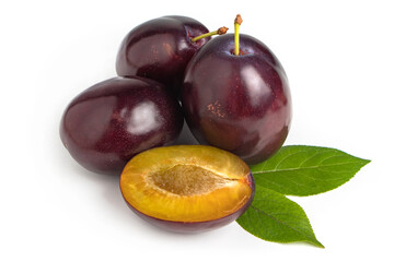 Isolated plums. Whole and a half of blue plum fruit isolated on white background.