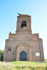 Fototapeta na wymiar The tower of the old brick Orthodox chapel