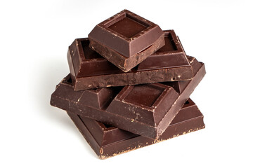 Broken pieces of dark chocolate close up