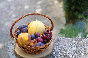 Vintage basket filled with various fruit. Selective focus.