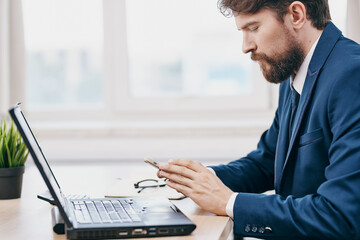 businessmen in the office in front of a laptop executive success