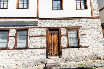 Fototapeta na wymiar Old traditional stone house in small mountain village