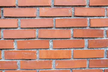 Red brick wall. Close-up photo of brick wall texture background.
