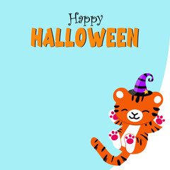 Banner on a blue background Halloween, 2022, New Year, Cute funny tiger cub in a hat, New Year's tiger playing and lying on his back