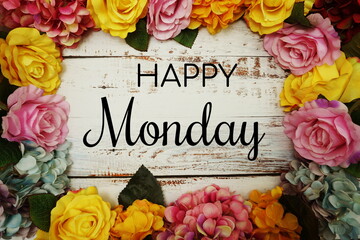 Happy Monday text and Flowers Colorful Border Frame on wooden background