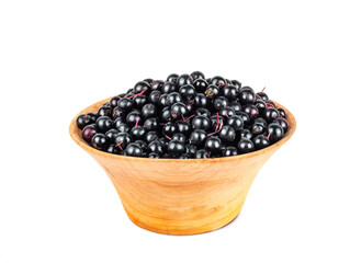 Elderberry in a wooden cup isolated on a white background