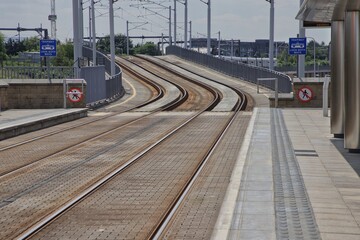 Fototapeta premium Tram tracks disappearing over a hill