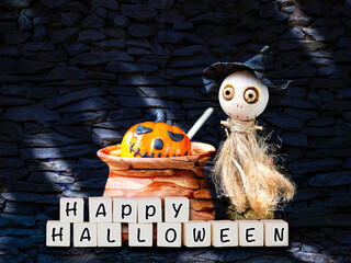 Happy Halloween invitation card background concept, Cute little wooden witch doll making poison halloween pumpkin in clay pot over abstract stone pattern background, Halloween decorate item