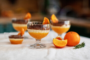 Homemade tiramisu with tangerines on a table