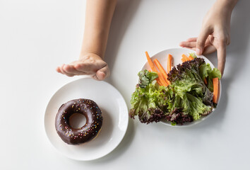 Top view hands woman want to eat healthy vegetable, fruits and don't need eat junk food. Dieting...