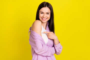 Profile photo of cute brown hairdo young lady point shoulder wear pink shirt isolated on yellow...