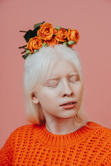 Lifestyle image of an albino girl posing in studio. Concept about body positivity, diversity, and...